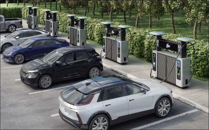 Electric vehicles at charging stations.
