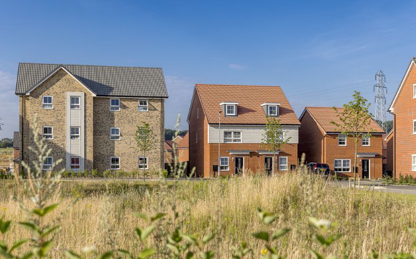 Photo of rental homes next to a field.