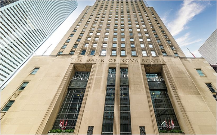 Photo of a large office building, looking up from ground level.