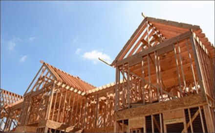 Photo of apartment building under construction.