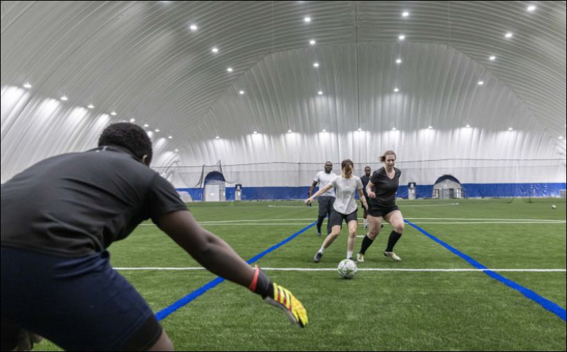 Photos of soccer players in action at a new domed facility in Calgary.